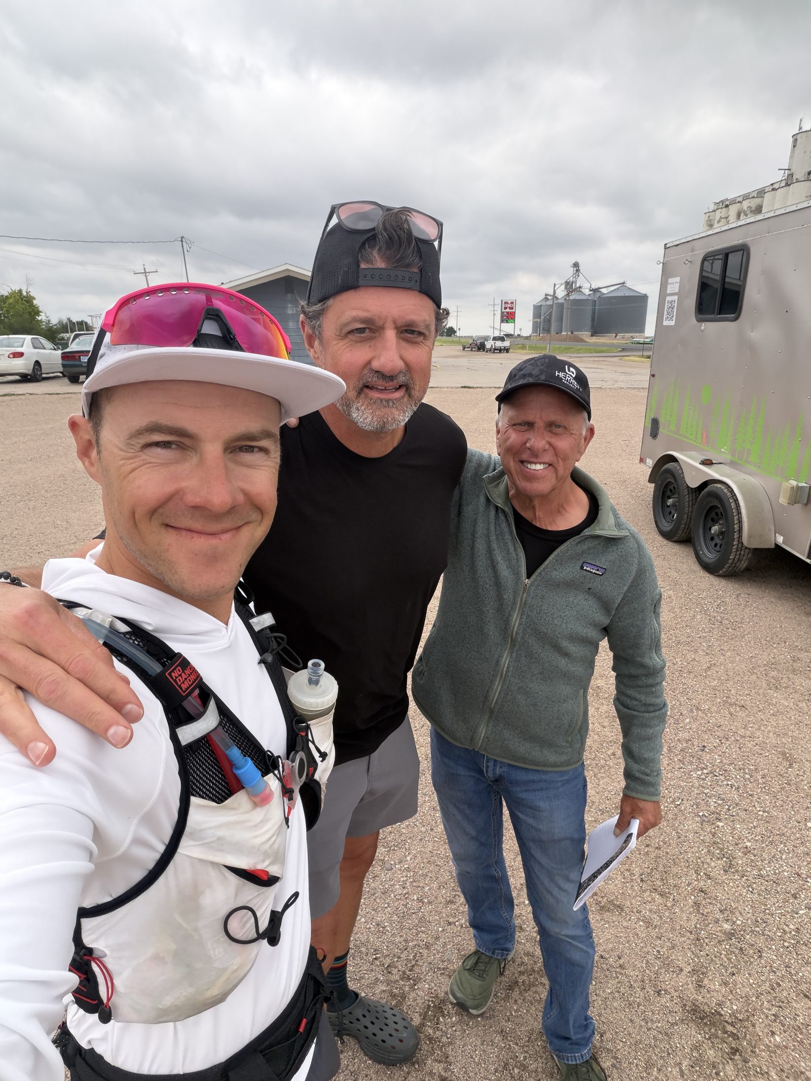 Collin, a friend, and Kevin beside the support trailer