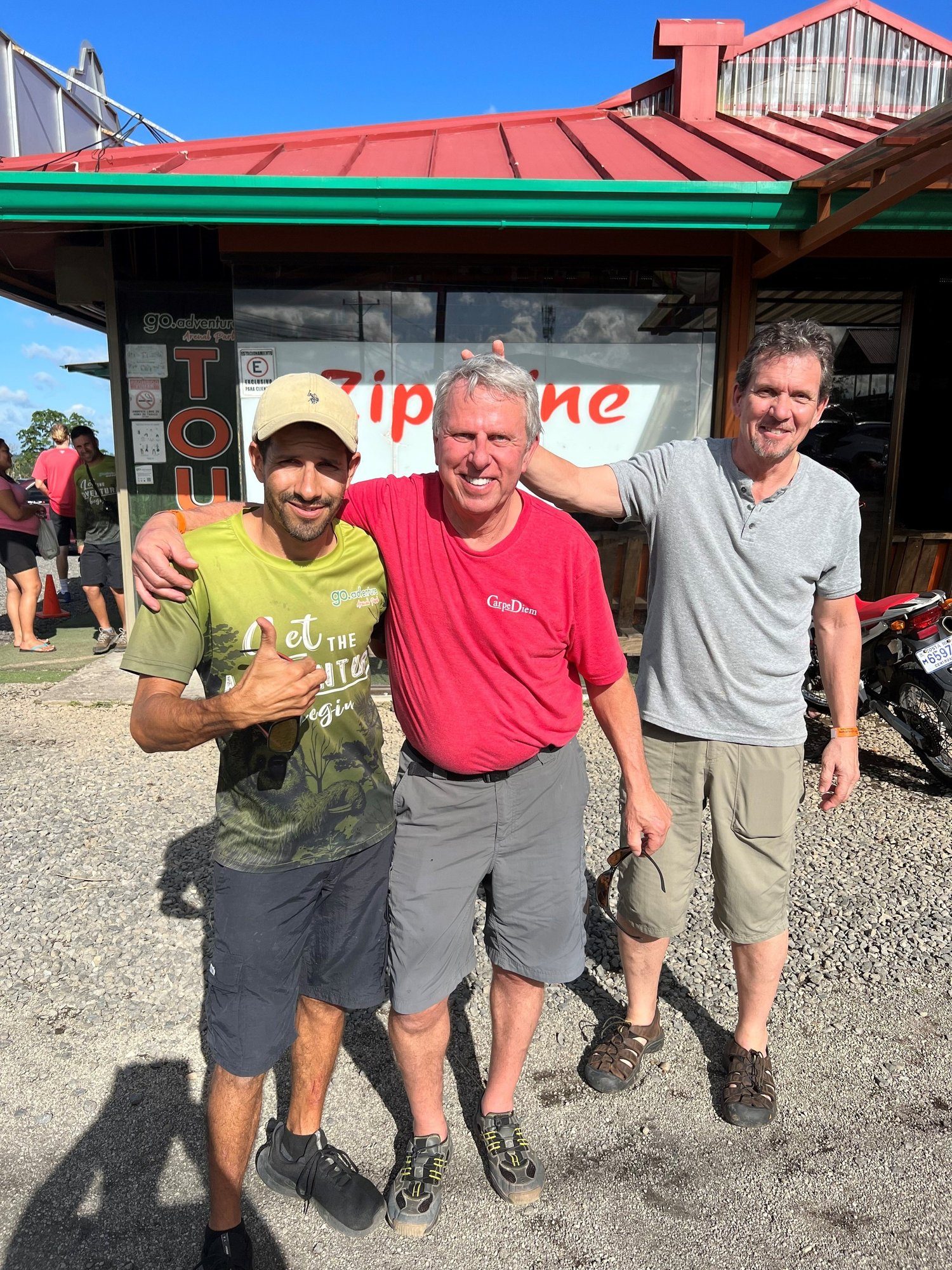 Three friends outside a small mountain-town restaurant